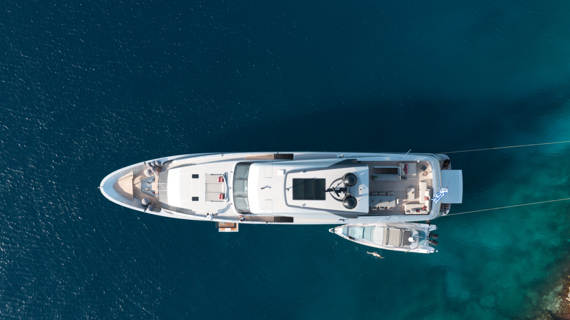 M/Y Naia aerial off Mykonos — Sanlorenzo 40 Alloy at anchor near Psarou beach
