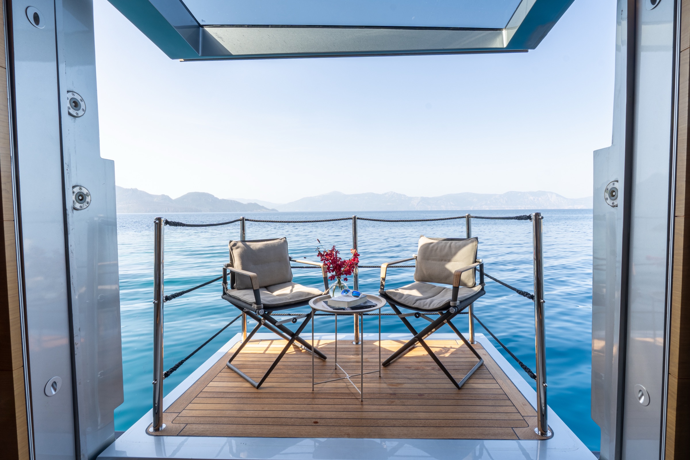 M/Y Naia Master balcony · sea-level Cyclades anchorage